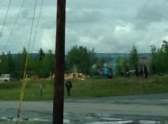 Cooking moose soup in drums over open fires
