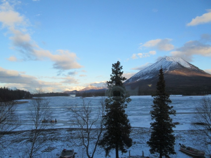 Lake Clark, Tanalian Mountain.  Notice the snow machine pulling a toboggan load of kids in the lower letf.