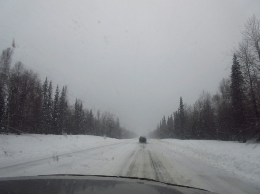 And then, the drive home.  Shortly after this picture, we entered whiteout conditions, which continued for 50+ miles.  Dani leaned out the left window, Shan leaned out the right window, spotting for James as he crept along, trying to keep from being sucked into a drift on either side.