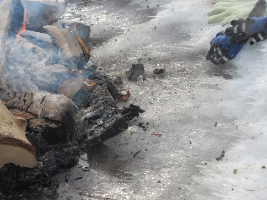 The fire makes neat spiky designs in the edge of the snow