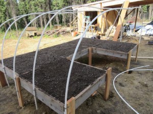 James raised and attached boxes we had previously had on the ground.  Jared and Christa helped Shannon fill and mix the soil.  Look - no more weeds!