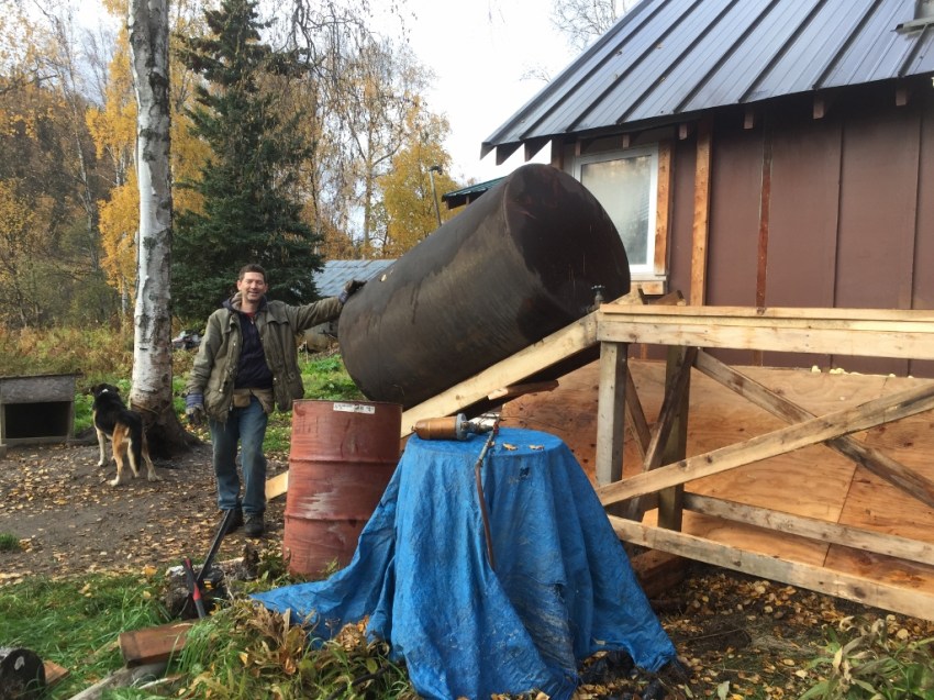 A little ingenuity, and it is possible for two people to move a heavy, cumbersome 300-gallon fuel tank from around the house and up onto a stand. ("Give me a long enough lever, and I will move the world!")