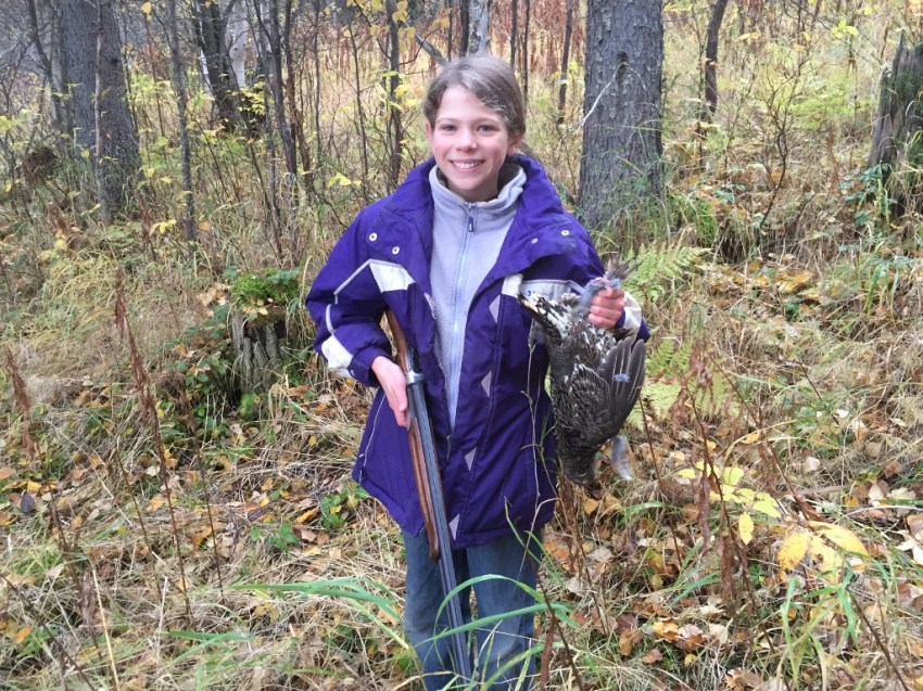 Christa's first bird: grouse taken on the wing in Grayling