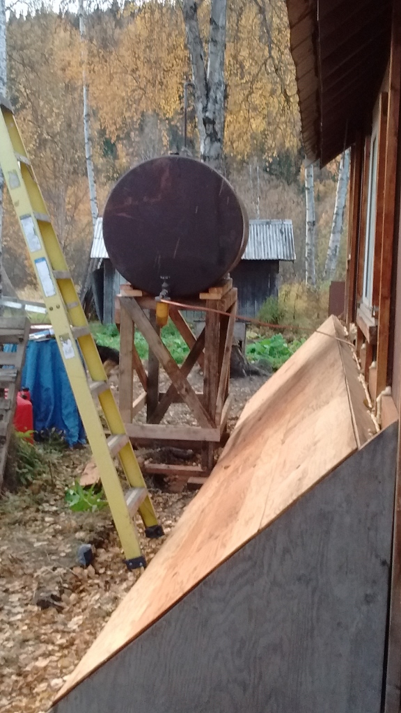 Fuel tank in place! The slanty wall is the "bandaid" to insulate the walls that have openings between the basement and outside.