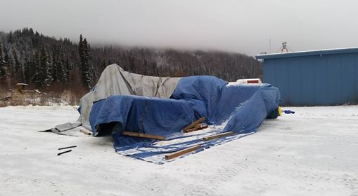 Freezing rain/sleet/snow covered the in the season's first snowfall last week. James and half a dozen men for as many hours employed creative methods to de-ice the plane, then covered it with tarps.