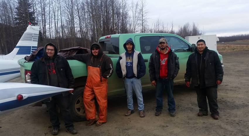 For a funeral potlatch in Grayling, men in Holy Cross provided a moose, shown here ready to load into our airplane. It's an unusual situation that the river isn't frozen yet, and there isn't enough snow to snow machine on, so air travel is the only way to get from village to village.